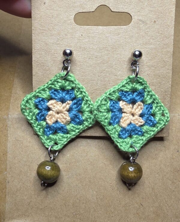 Small granny squares with studs and small dark wood beads