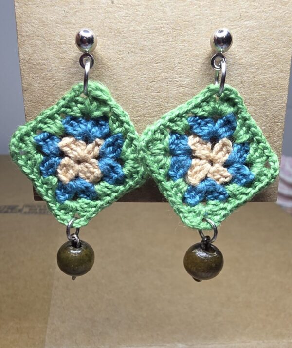 Small granny squares with studs and small dark wood beads